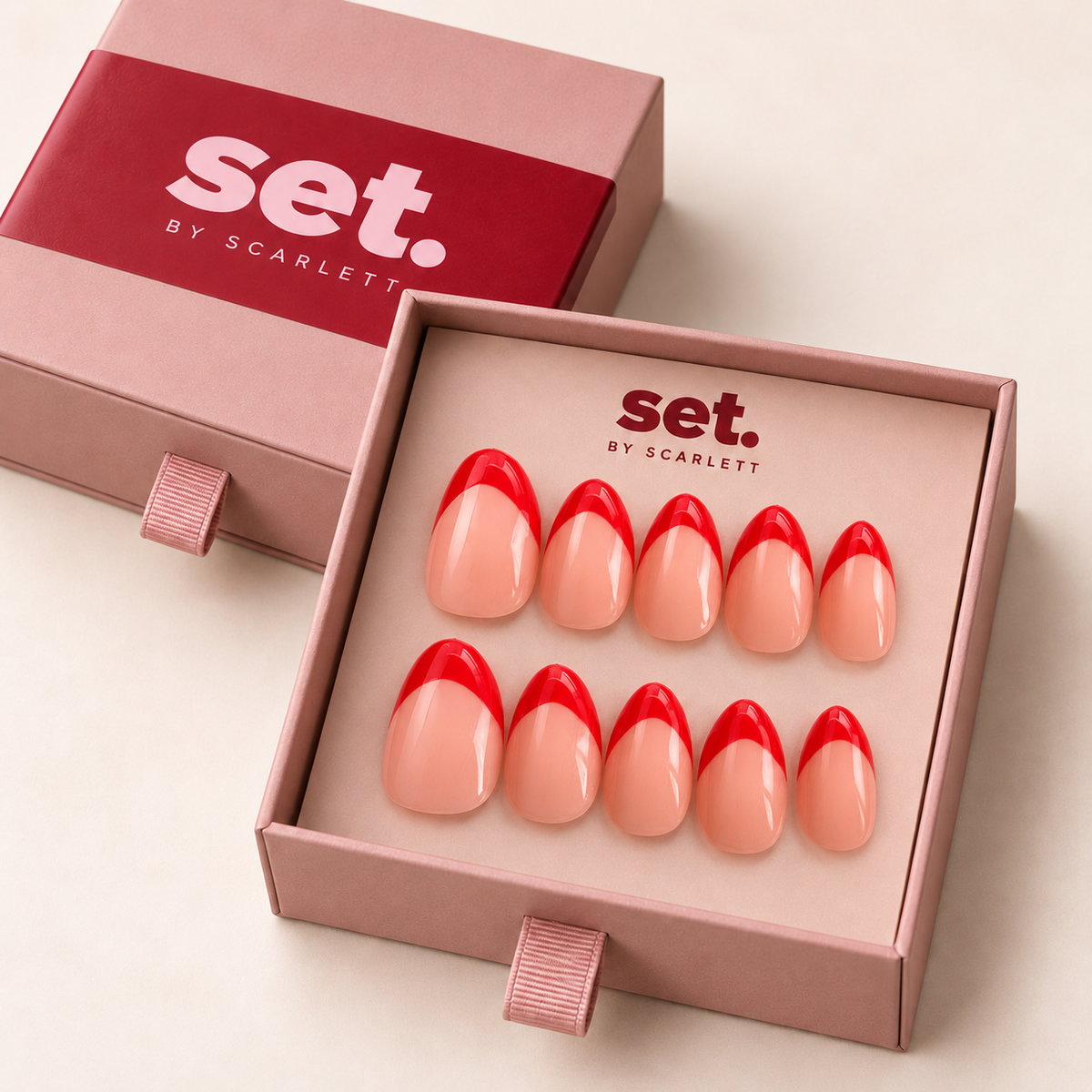 Cherry Line: Cherry-red French tips over a pink-nude base. Digitally styled packaging mockup based on Scarlett's photographed nail set.
