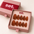 Cocoa Club: Glossy warm chocolate brown. Digitally styled packaging mockup based on Scarlett's photographed nail set.
