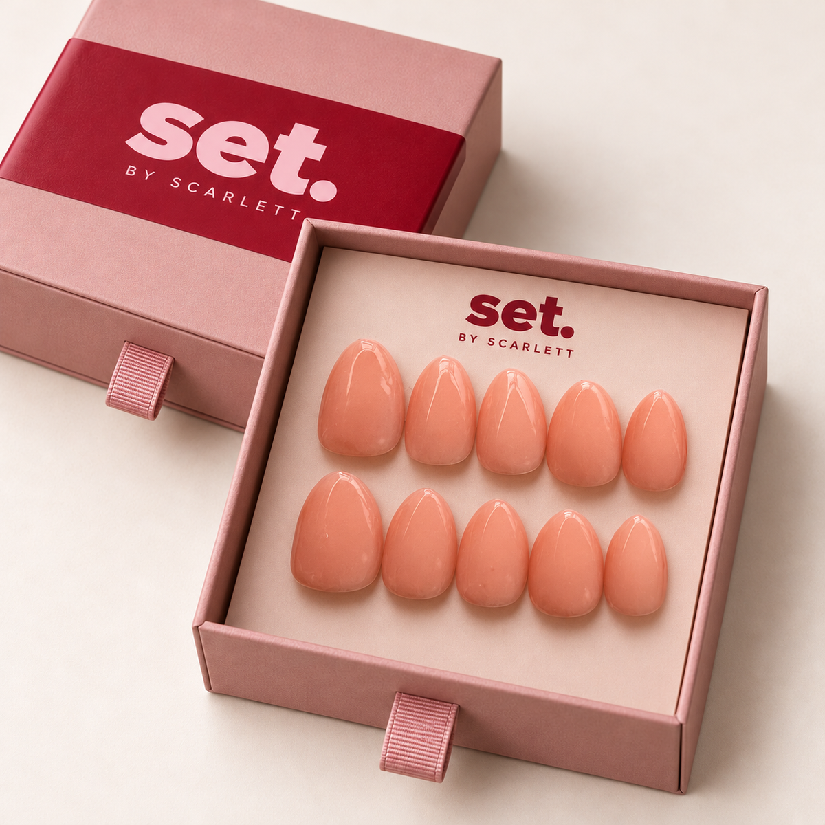 Peach Please: Glossy all-over peach-pink nude. Digitally styled packaging mockup based on Scarlett's photographed nail set.